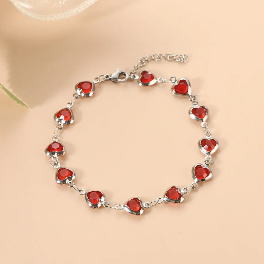 Devil's Eye Creative All-match Fashion Heart Bracelet in stainless steel on a wrist.