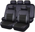 Black artificial leather car seat covers installed on front and rear seats of a vehicle