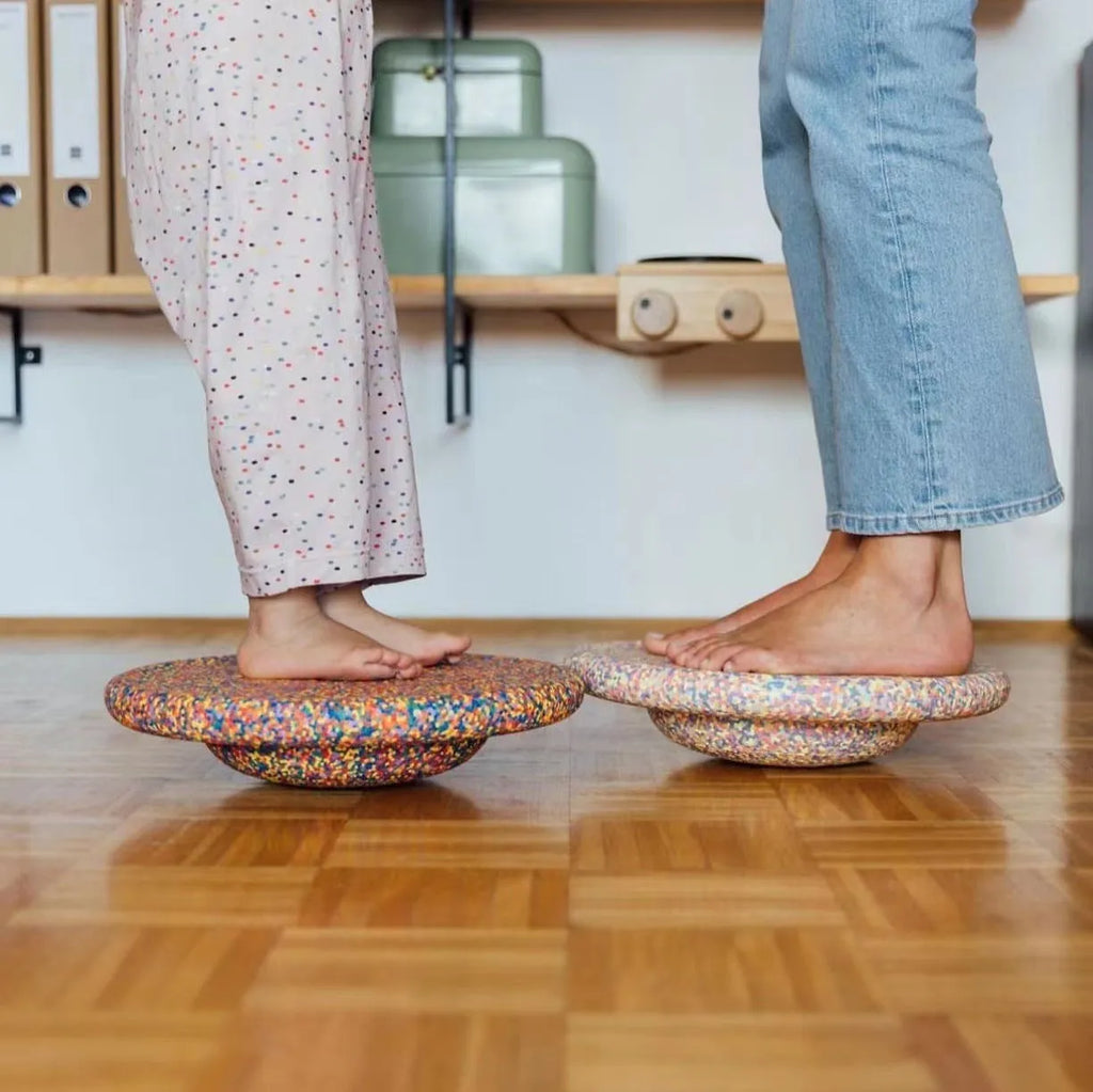Plastic surf balance board for children in mixed colour wood and black wood designs.