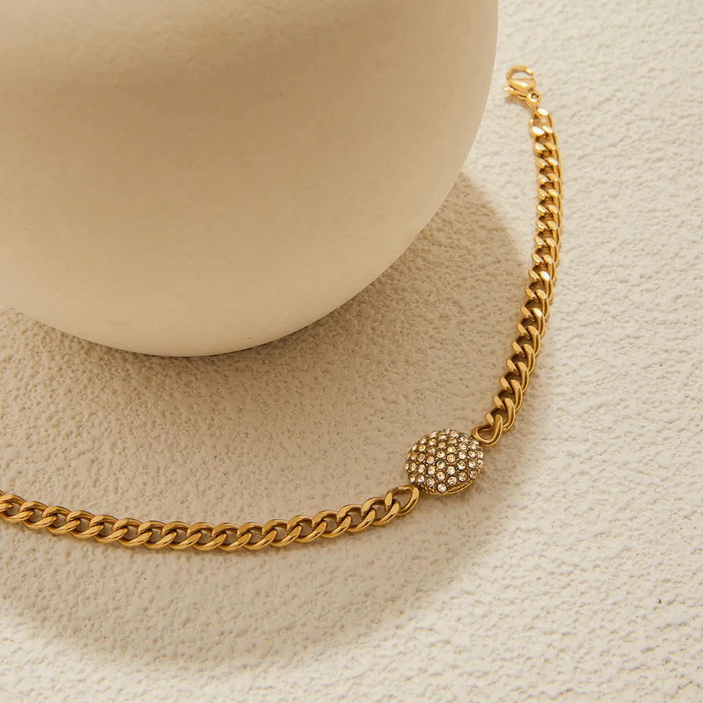 Women's stainless steel bracelet with electroplated finish, geometric round shape on a woman's wrist