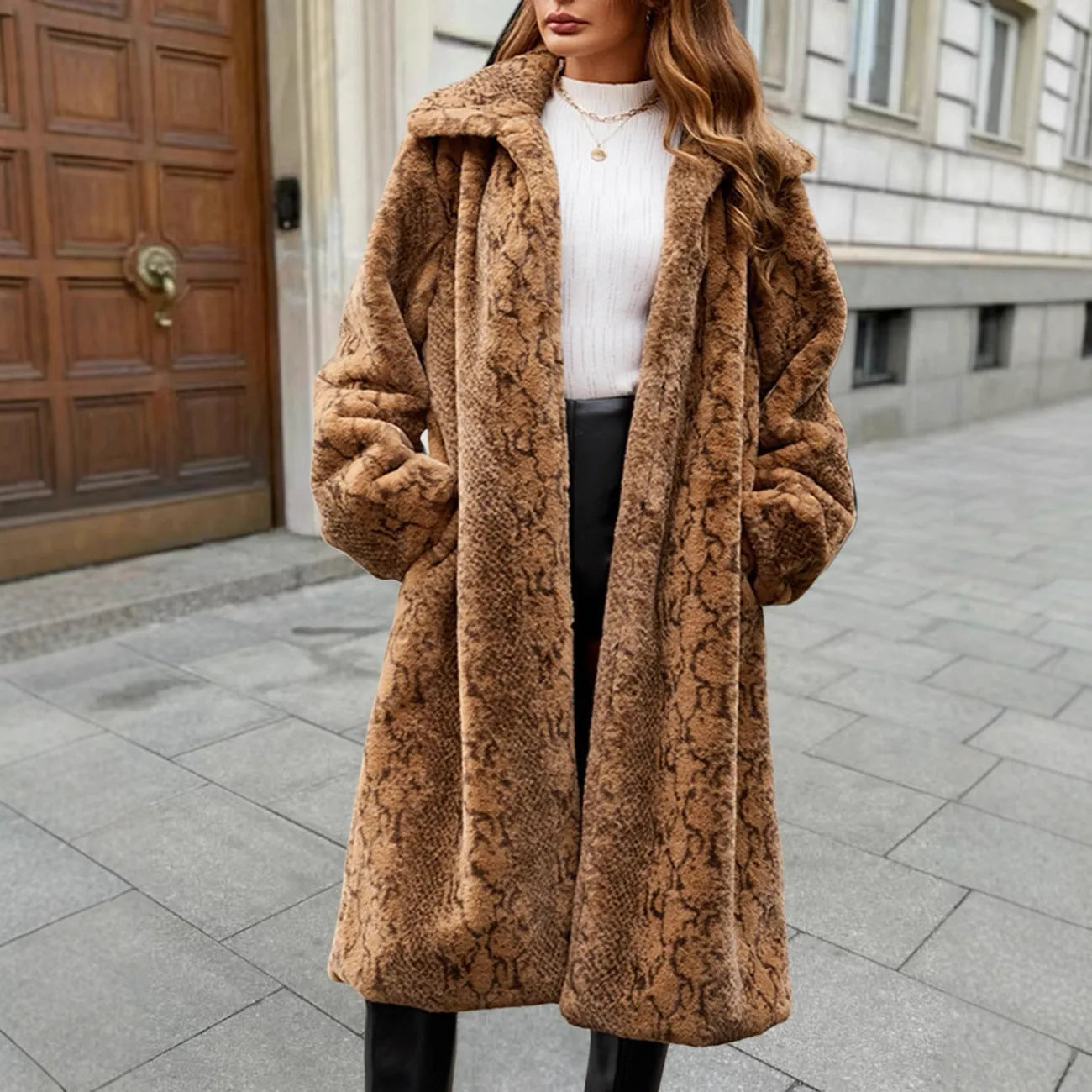 Women's brown leopard print faux fur over-the-knee coat with regular sleeves on a model.