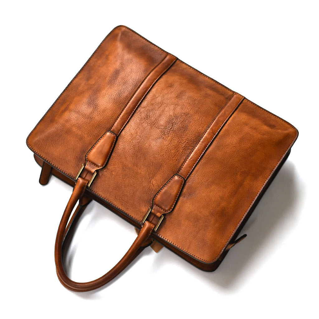 Men's brown leather business handbag with horizontal square shape and zipper closure