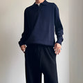 Pure wool loose-fit polo sweater with a lapel collar in navy blue colour.