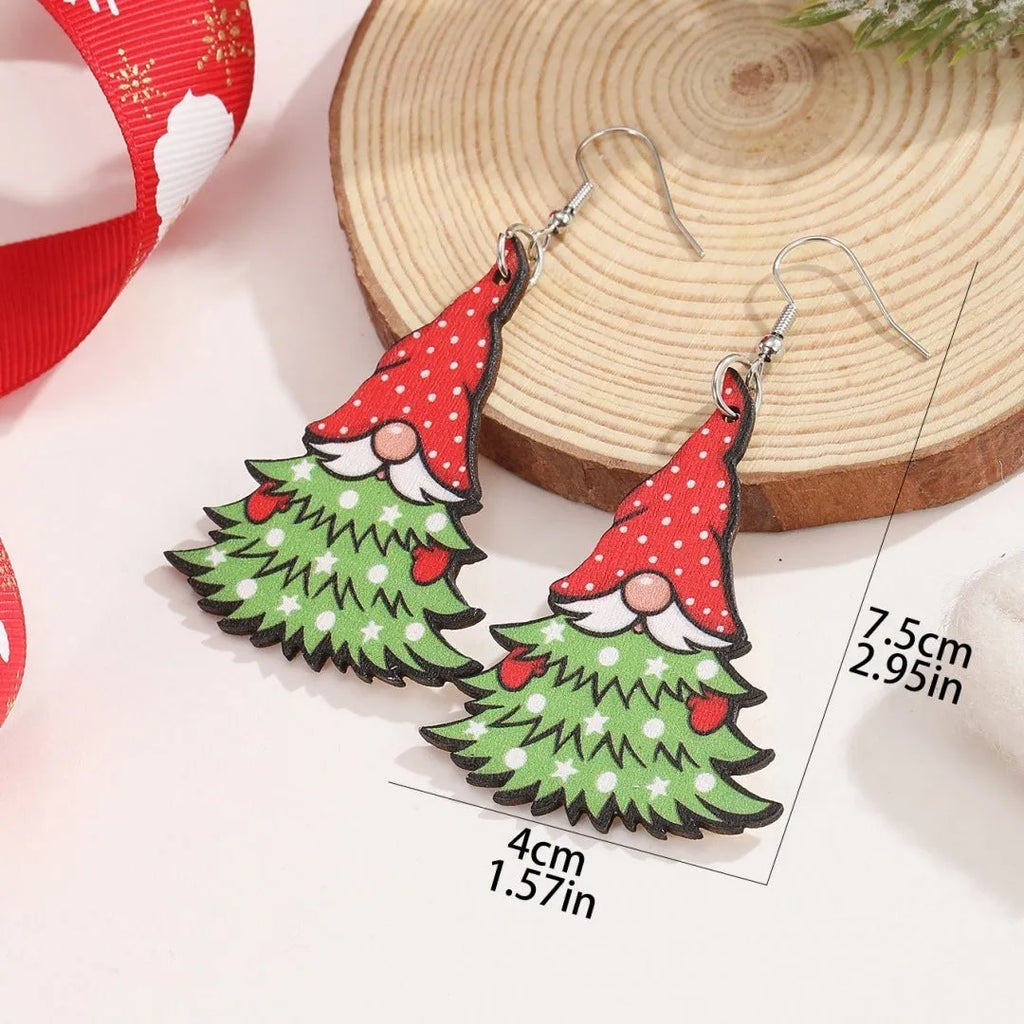 Wooden Christmas earrings with printed tree and snowman designs featuring geometric shapes