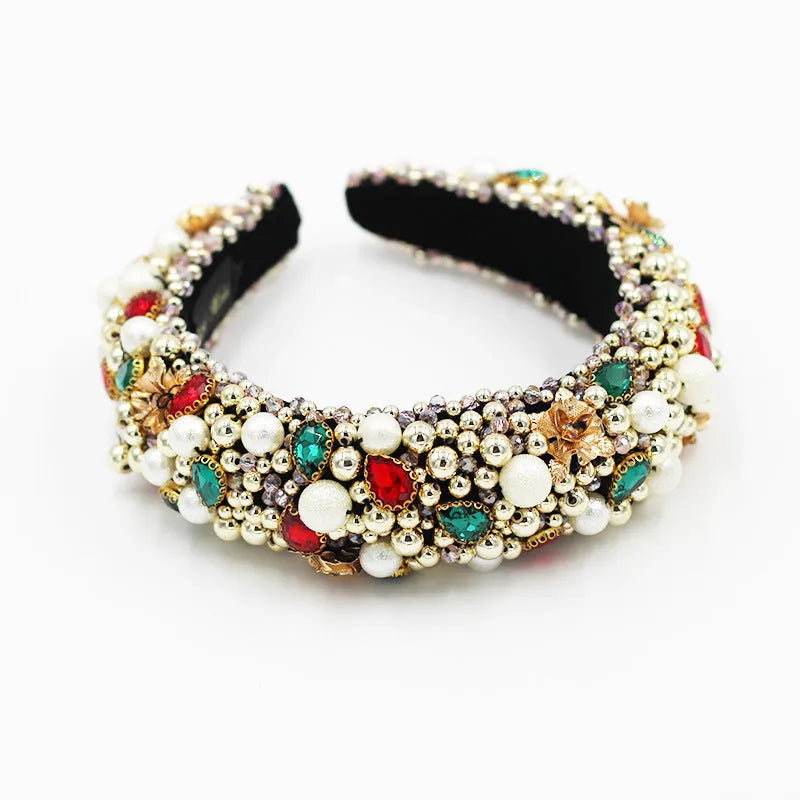 Gold-plated baroque headband with plaid pattern and bow detail on a light background
