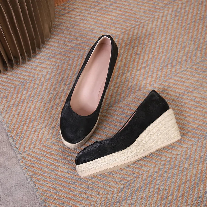 Women's wedge heel pumps with rope-wrapped bottom in apricot colour showing shallow open toe design