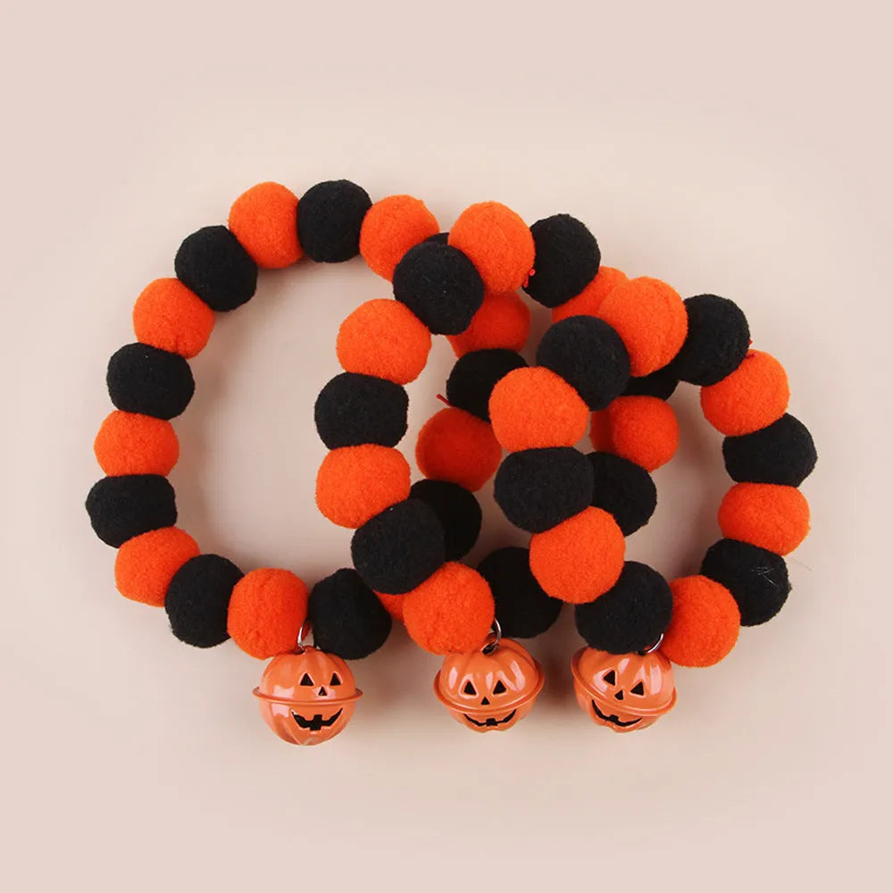 Halloween pumpkin-themed cat collar with Trick or Treat text and adjustable buckle.