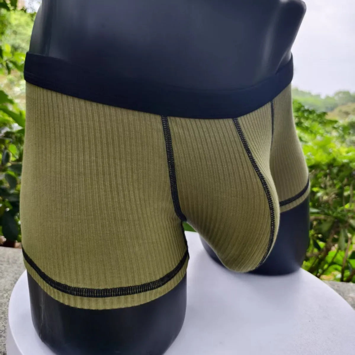 Men's solid colour thin fit boxers showing breathable fabric and body shaping design.