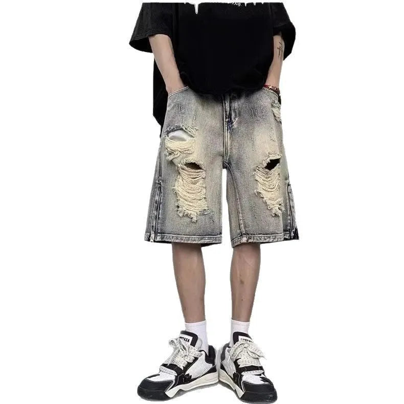 Blue retro denim shorts with a wide-leg loose fit and tattered detailing on a mannequin.