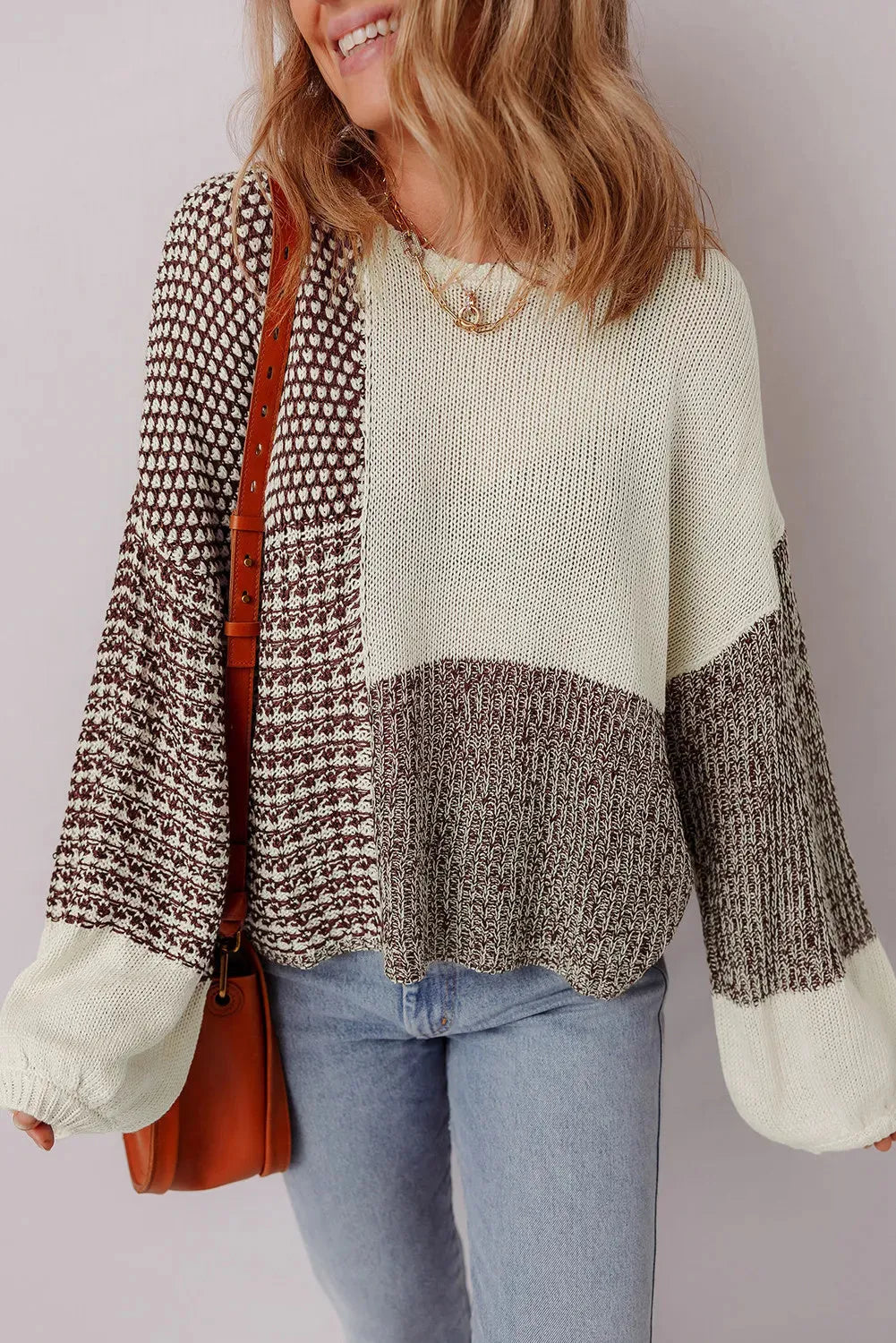 Dark khaki loose knit sweater with drop shoulders and a back tie detail.