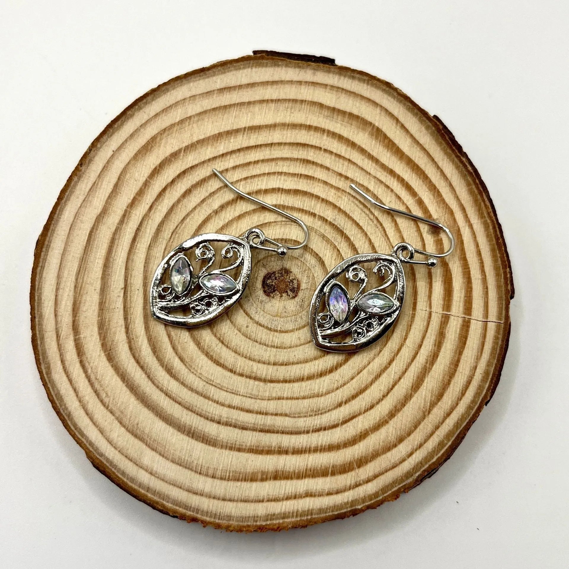Women's silver alloy earrings with colourful moonstone embedded in leaf design
