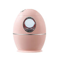 White round USB aromatherapy humidifier with 800ml water tank showing mist output
