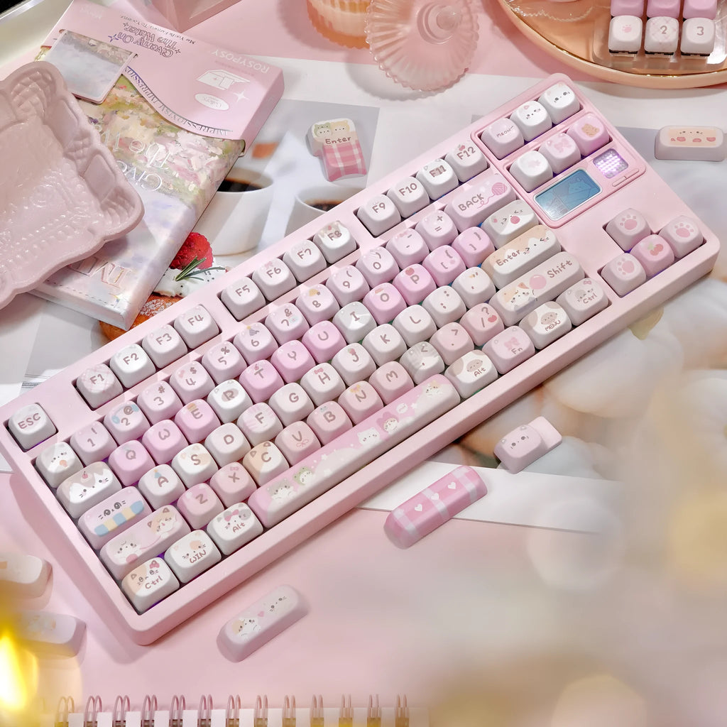 Pink cartoon MOA height plastic keycaps with five-sided sublimation arranged in a full set layout.
