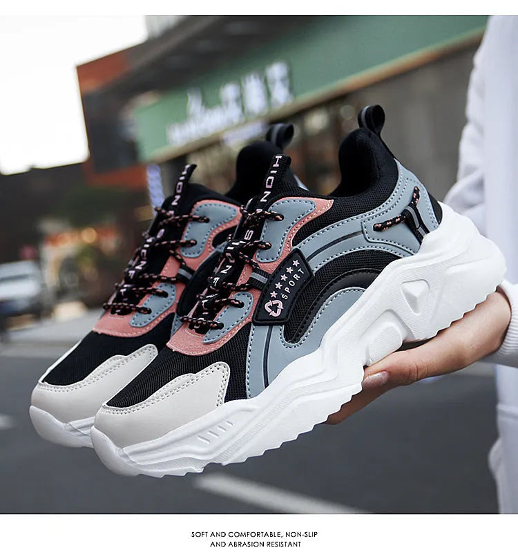 Women's white mesh casual sports shoes with a thick sole and a front buckle strap.