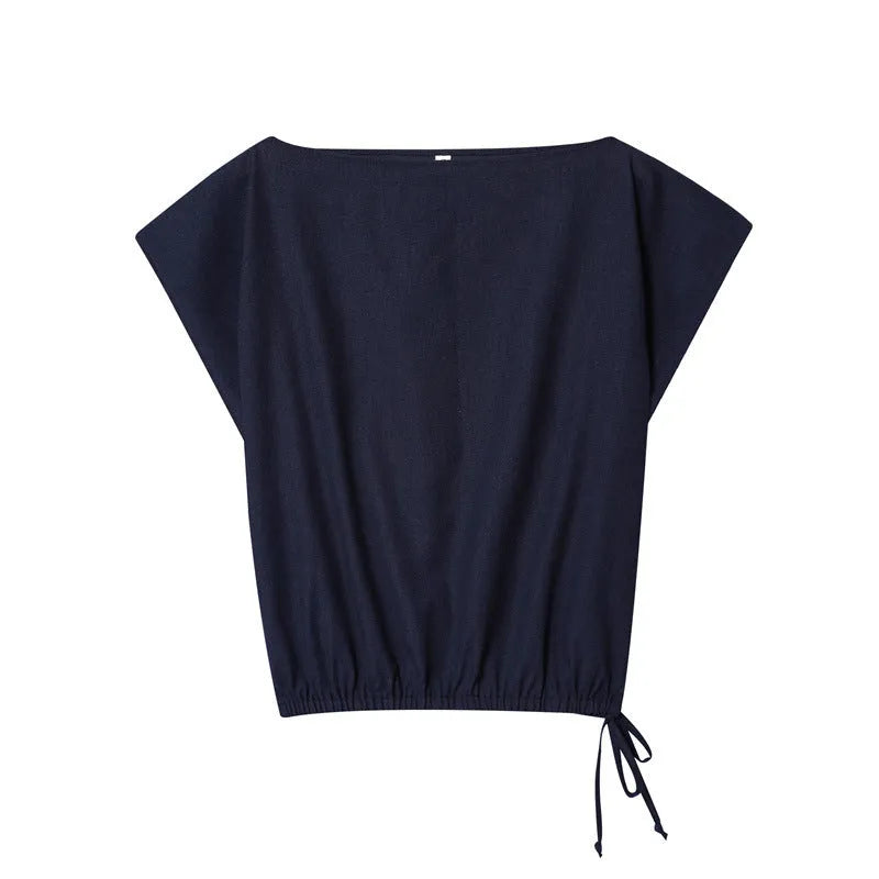 Women's linen blend co-ord set showing flounced sleeve off-neck top with wide leg trousers in temperament commute style