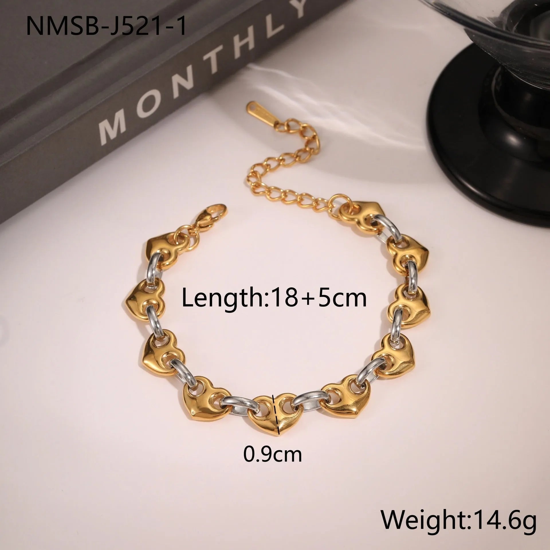 Women's stainless steel bracelet with a hollowed-out heart charm in gold, steel or colour electroplated finish.