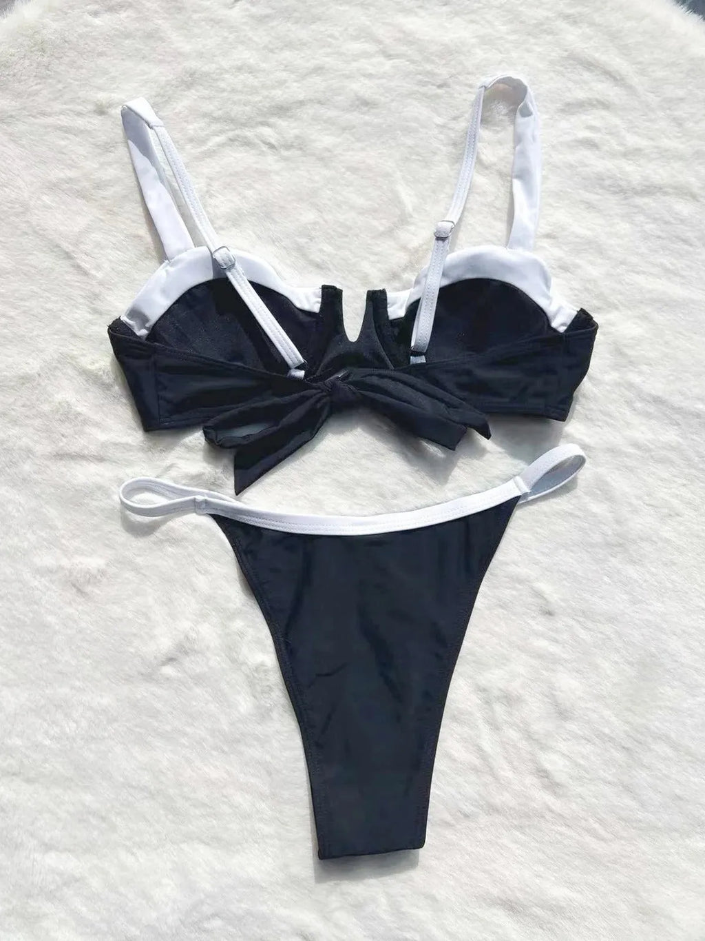 Black low-waist bikini swimsuit for women with split leg stitching, shown as a full set.