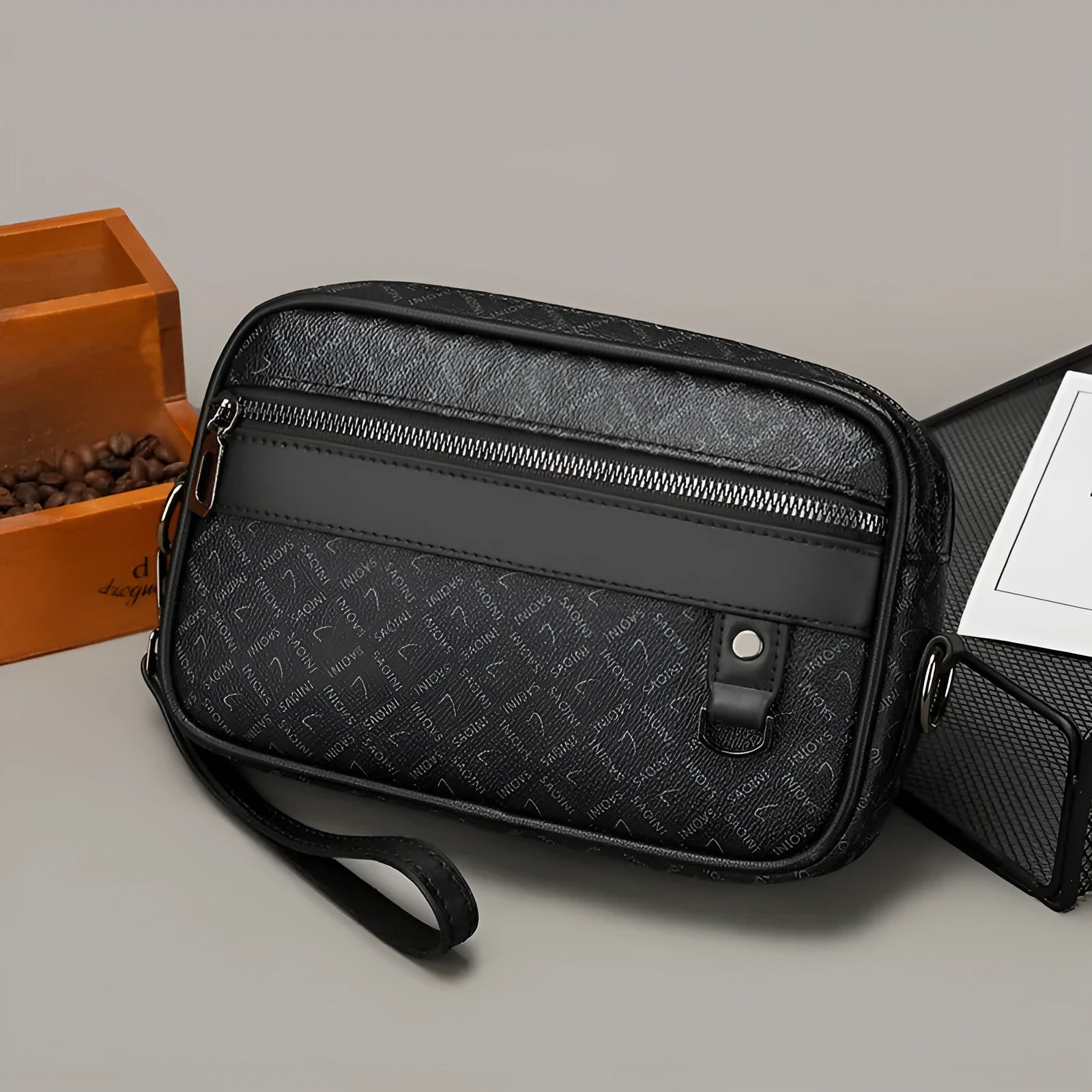Men's black casual shoulder messenger bag with geometric pattern, shown with handheld top handle and adjustable shoulder strap.