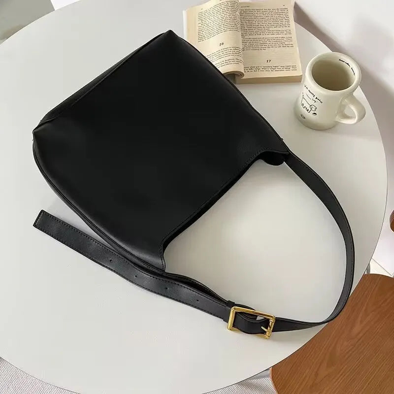 Women's black and brown PU shoulder bags with swing thread detail, dimensions 28×32×12cm