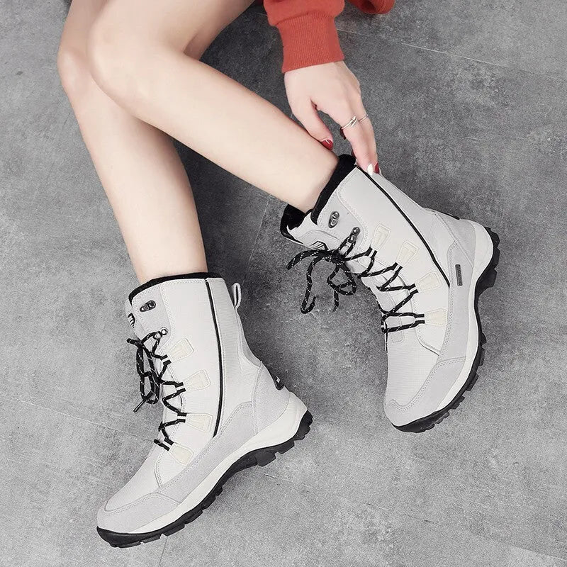 Women's mid-calf thermal snow boot in black with a round toe, genuine leather upper, and rubber sole.