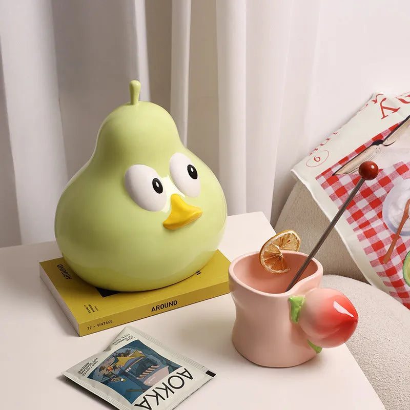 White ceramic pear-shaped tissue box holder with cute animal design in green colour option