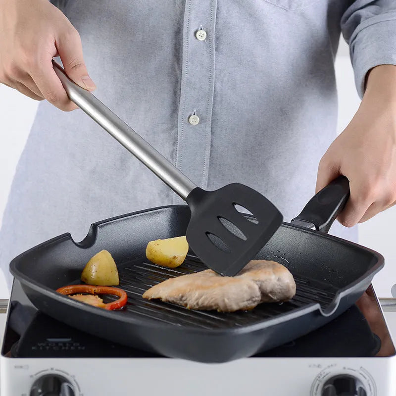 Black silicone and stainless steel cooking utensil set with 16 pieces including spatulas and spoons.
