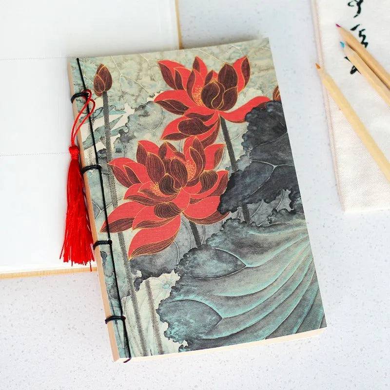 Antique wire-bound notebook with embossed cowhide cover and black wax rope binding
