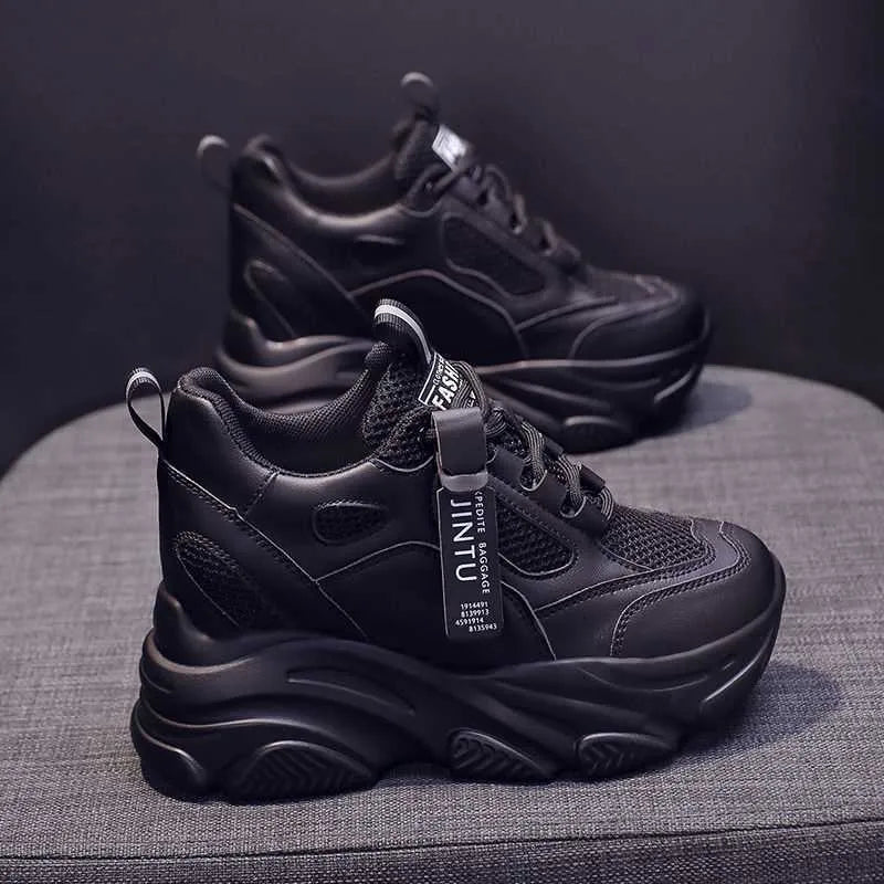 Women's black mesh platform casual shoes with hollow-out design and toe holder on a white background