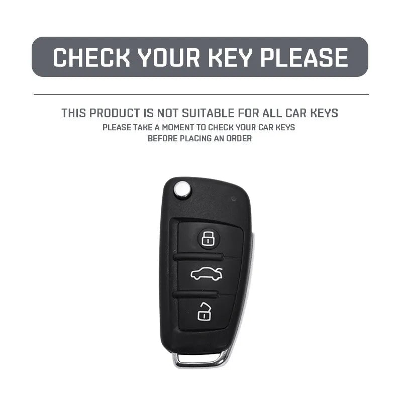 Carbon fibre pattern car key cover with a small rectangular mirror set into the feilin material casing.