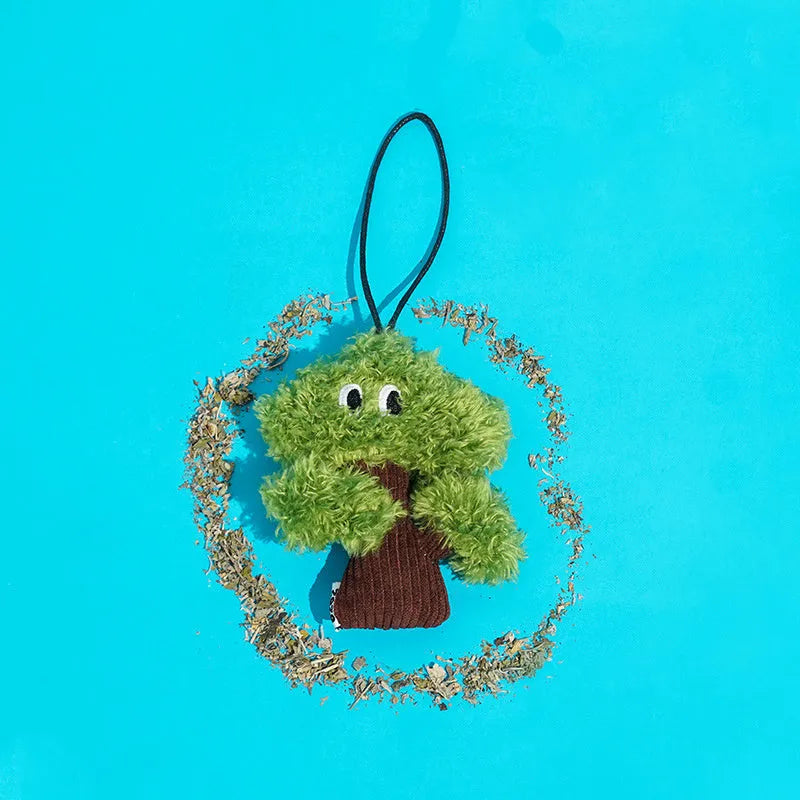 Pine tree shaped cat chew toy with fabric detail in three size options for feline dental enrichment