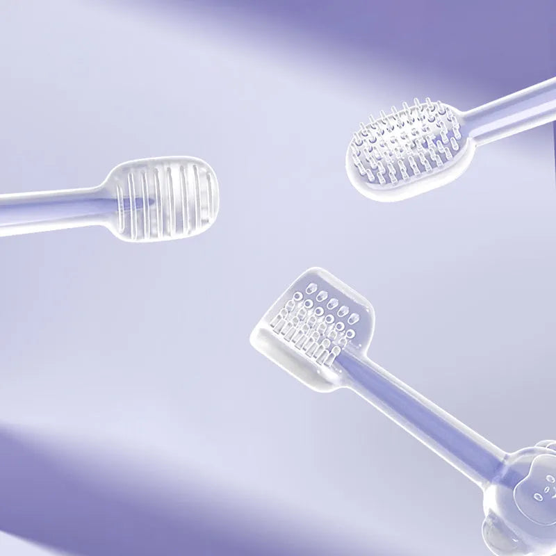 Blue, green, and purple dual-head silicone toothbrushes for pet dental care on a white background.