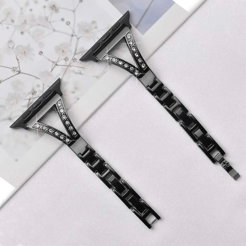 Silver herringbone diamond pattern metal strap for Apple Watch, showing adjustable links and connector lugs.