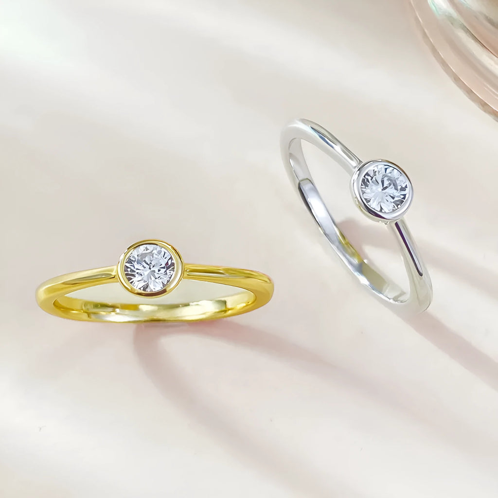 Minimalist silver crown ring with linear details in electroplated gold or platinum colour.