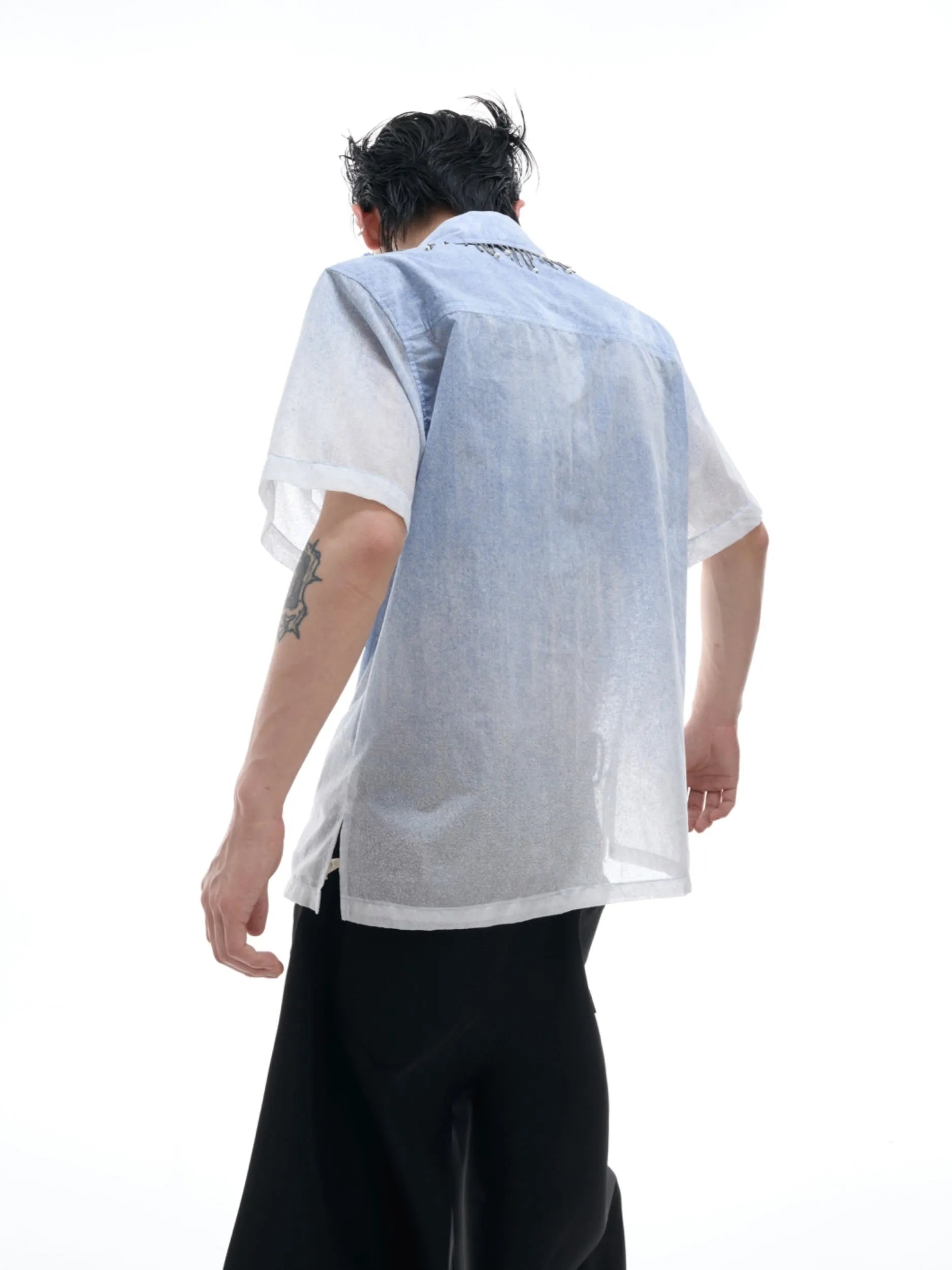 Men's blue and white gradient loose-fit short sleeve shirt on a hanger