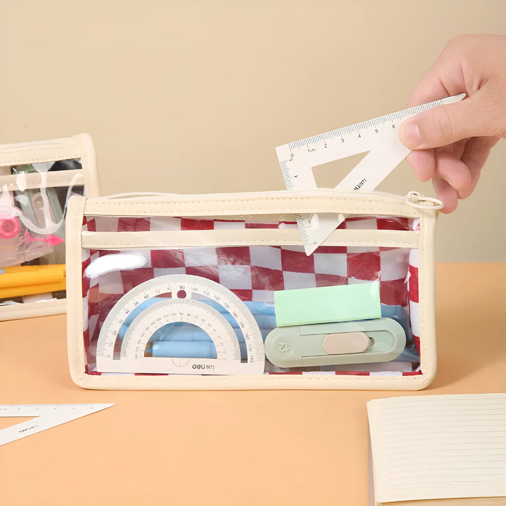 Large transparent PVC pencil case with a black and white chessboard grid pattern, showing pens inside.