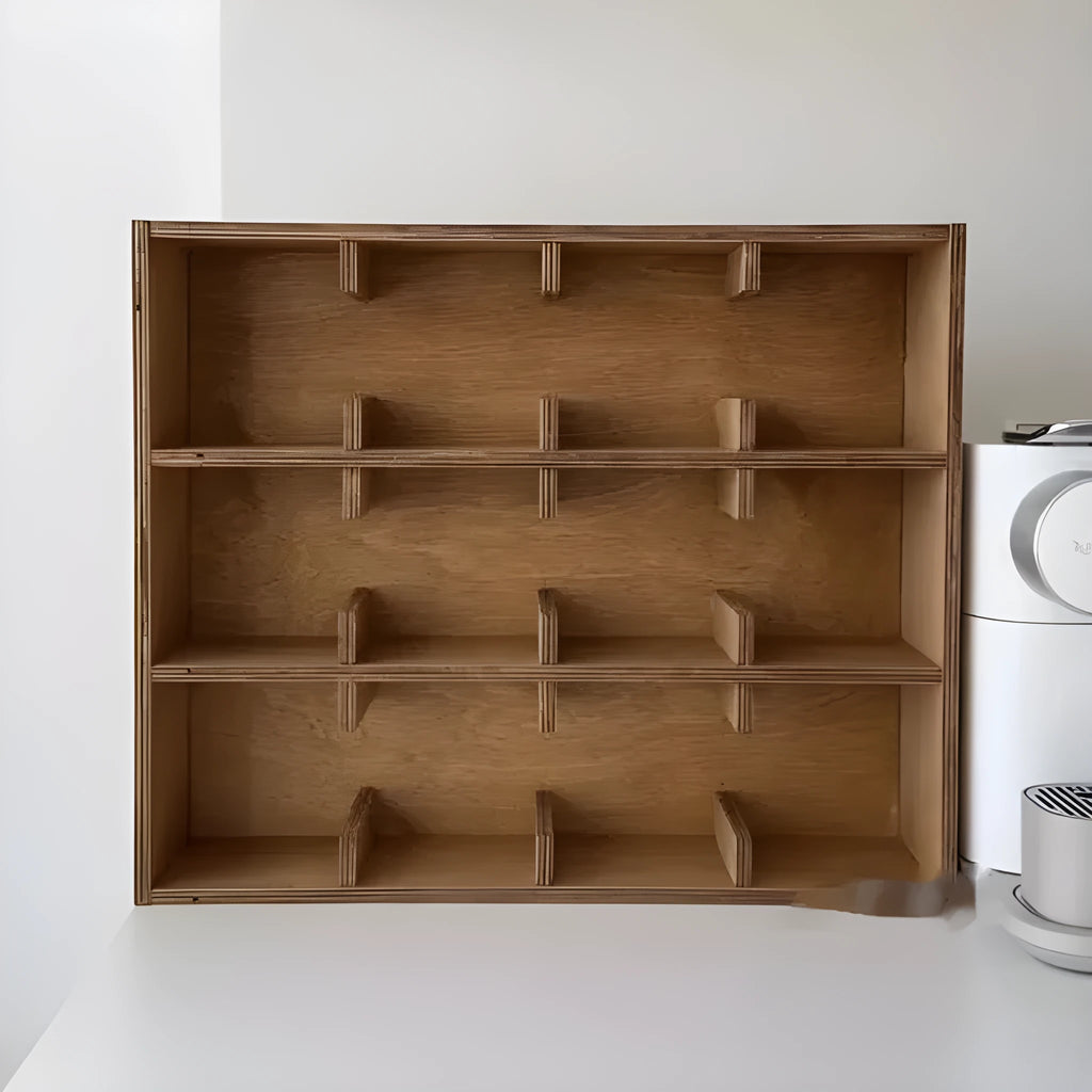 Solid square wood storage rack with multiple grid compartments for cups and mugs in birch wood colour.