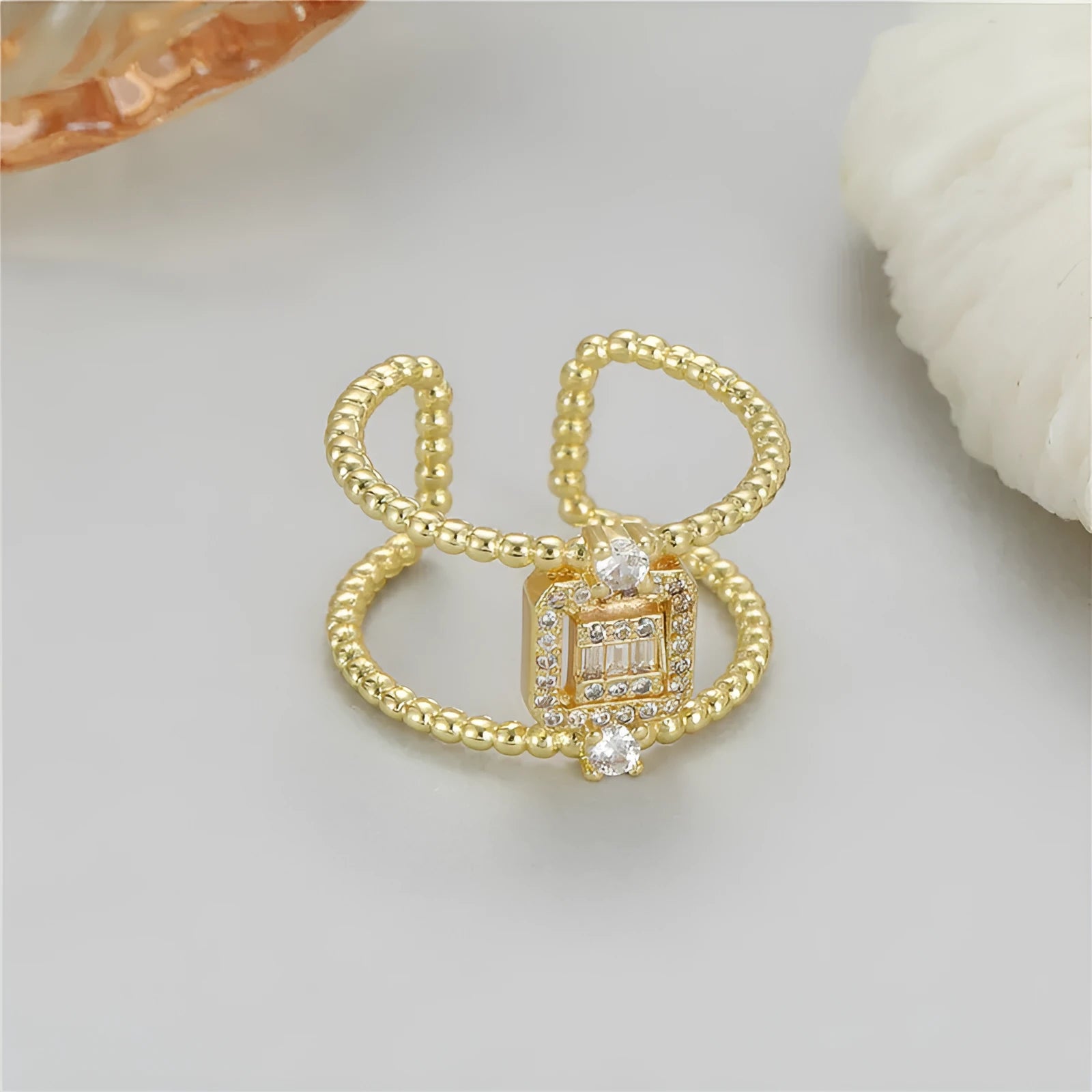 Open ring with adjustable opening in 14K copper-plated gold finish, U-shaped asymmetric design