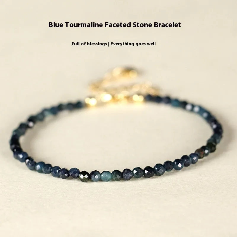 Blue tourmaline beaded bracelet with silver spacer beads and adjustable clasp