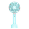 Blue mini handheld desktop fan with USB port and three-speed control on white background