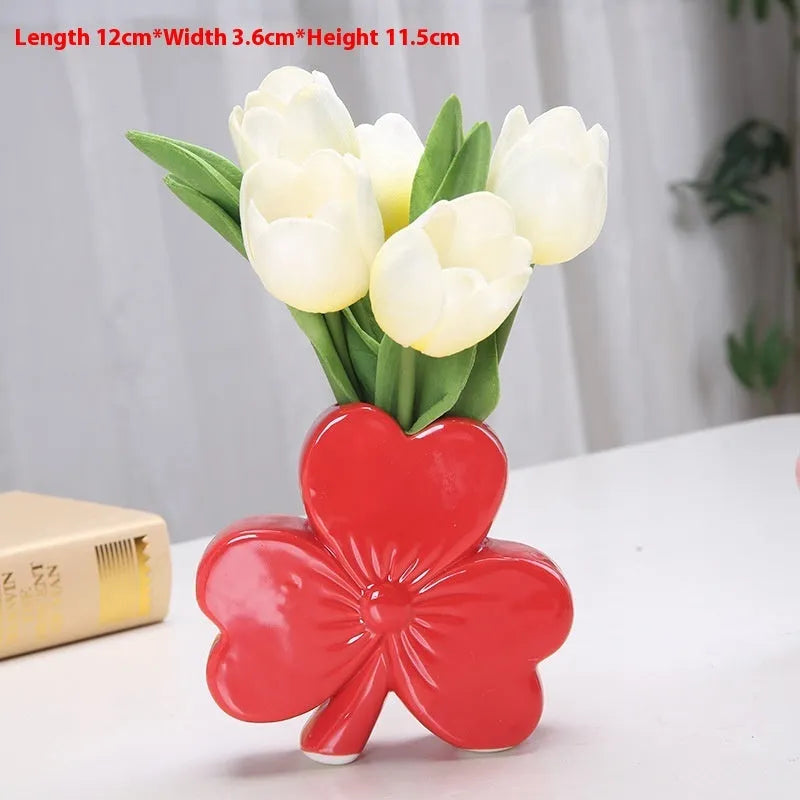 A white porcelain ceramic vase in European style for desktop decoration.