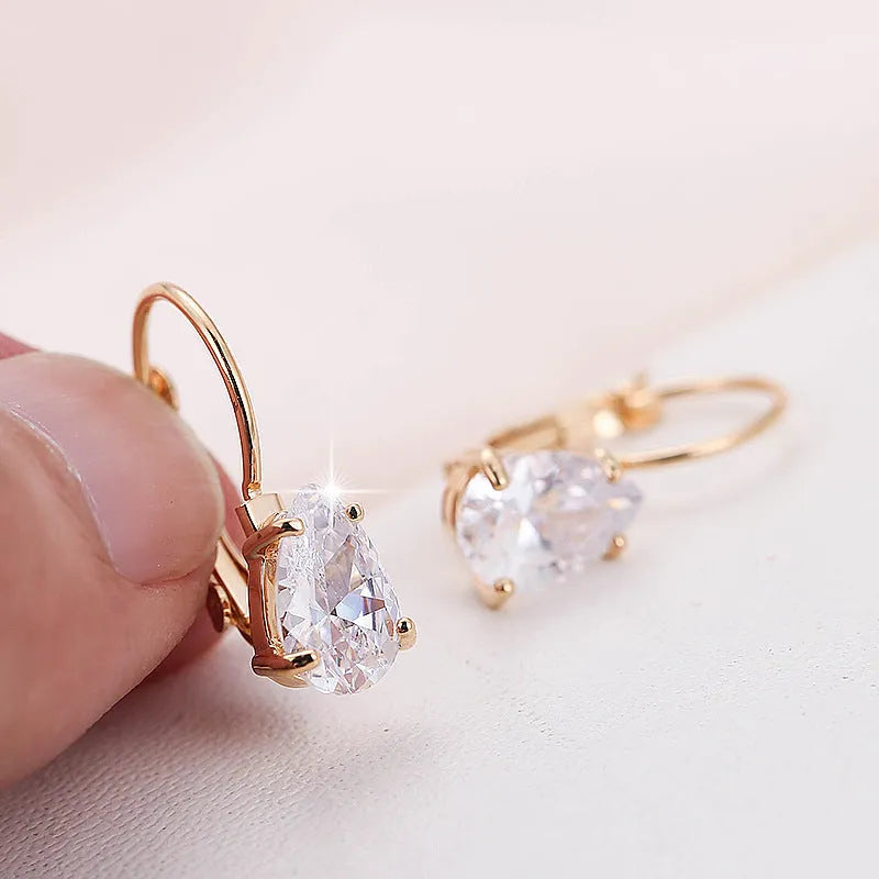 Copper drop-shaped fashion earrings with platinum plating and inlaid gem details.