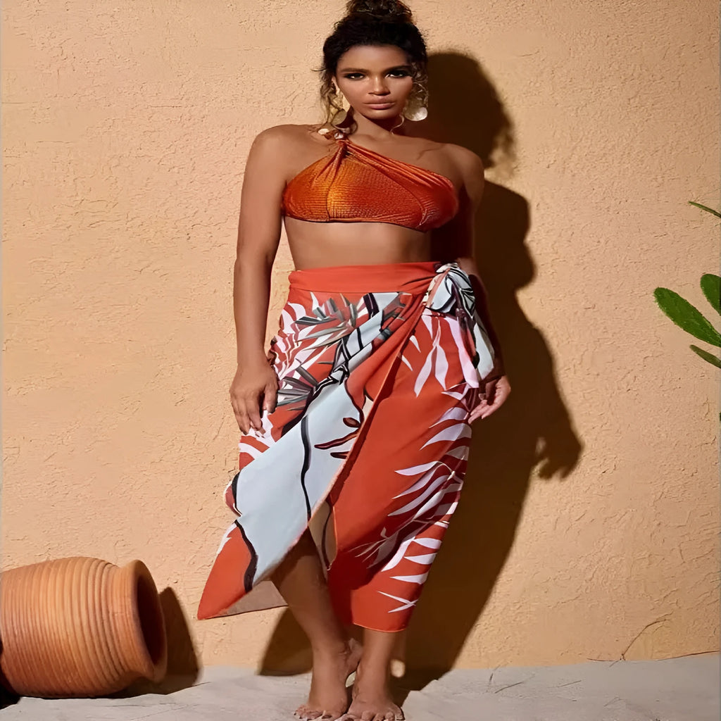 Women's brown high-waist push-up bikini with a sheer split chiffon dress overlay.