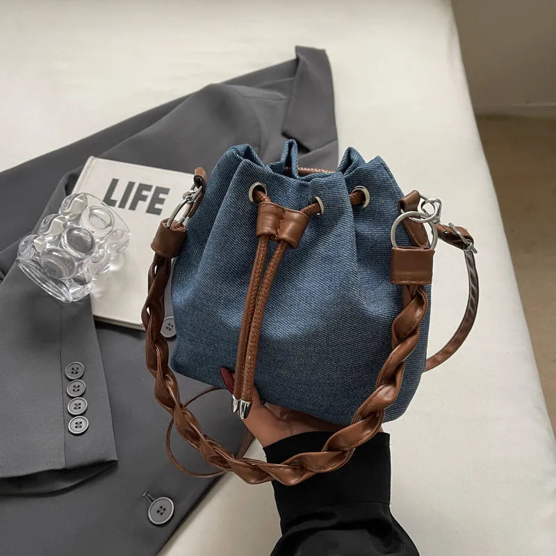 Blue one-shoulder cross-body bucket messenger bag with synthetic leather lining