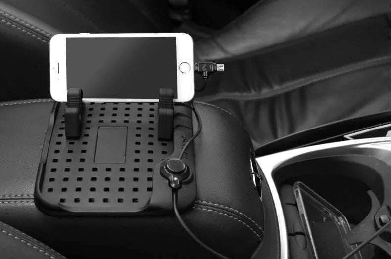 Black silicone car charging bracket with magnetic holder and three charging ports on a dashboard