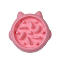 Green plastic slow feeder dog bowl with raised bone-shaped ridges inside.
