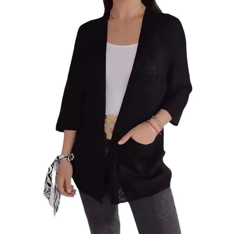 Women's waffle knit cardigan coat with nine-quarter sleeves in army green colour showing pocket detail