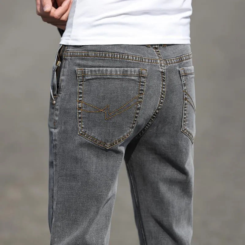 Men's smoky gray straight leg jeans with high elasticity rabbit fur fabric on low waist mannequin