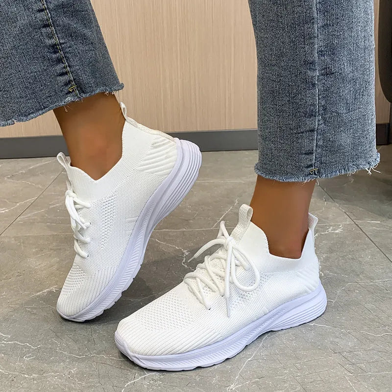 Women's low-top mesh breathable tennis shoes in creamy white, orange, and gray colours.