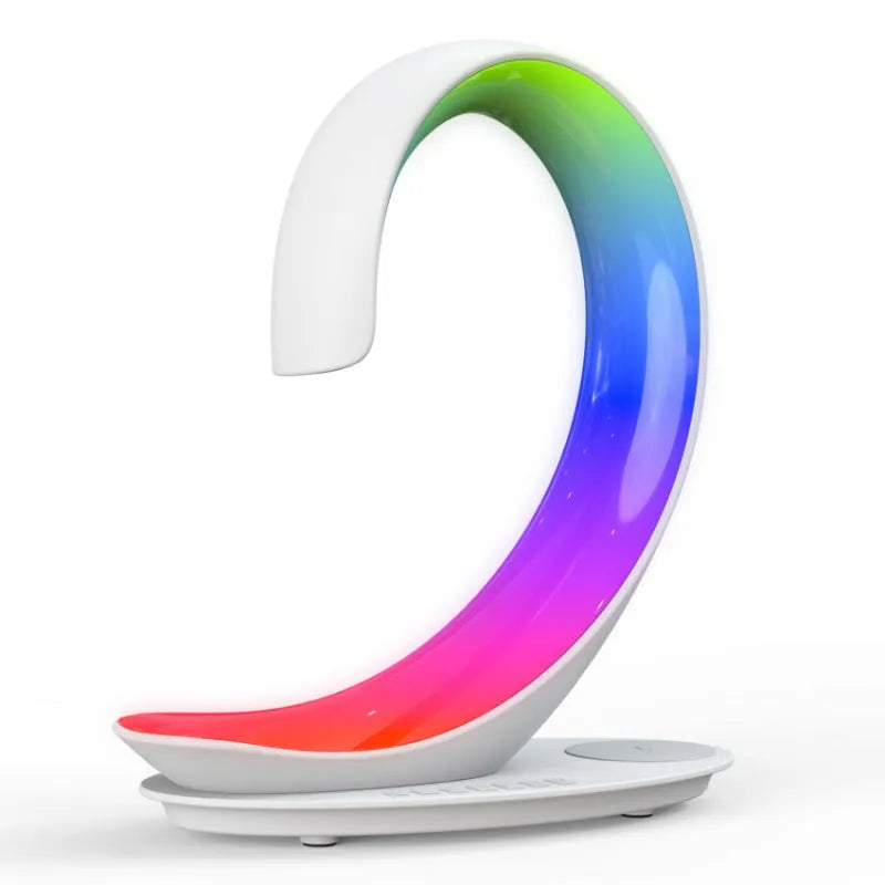 White swan shaped desk lamp with wireless charging pad and Bluetooth speaker featuring multi-colour lighting