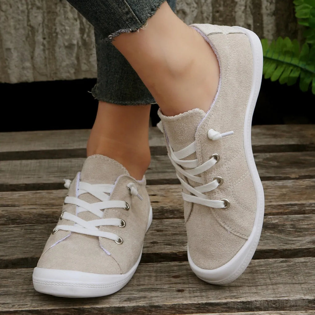 Women's creamy white low-top fabric casual sneaker on a wear-resistant rubber sole